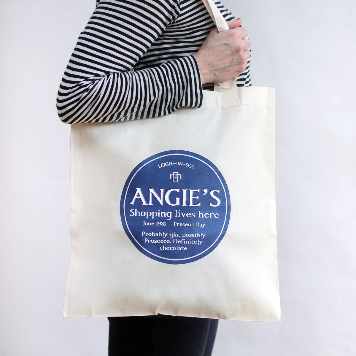 A personalised tote bag that features a persons name and fun quote about them