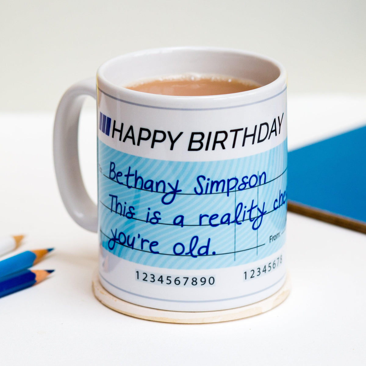 personalised mug designed to look like a cheque with a funny pun and personalised details