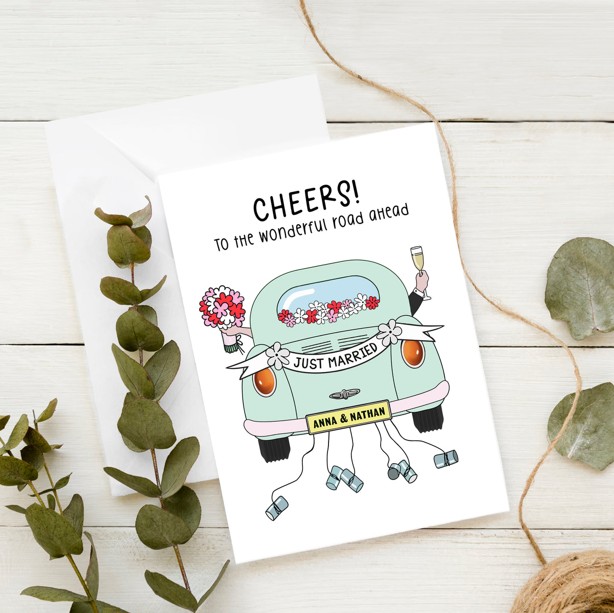 Custom wedding card with illustration of car and tin cans along with couples names