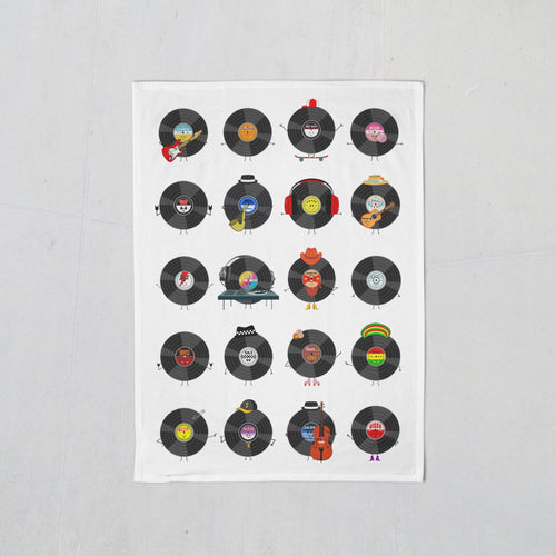 A tea towel illustrated with vinyl records showing all the different genres of music