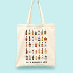 A tote bag illustrated with bottles of rum and the words 'It's a rum-derful life'