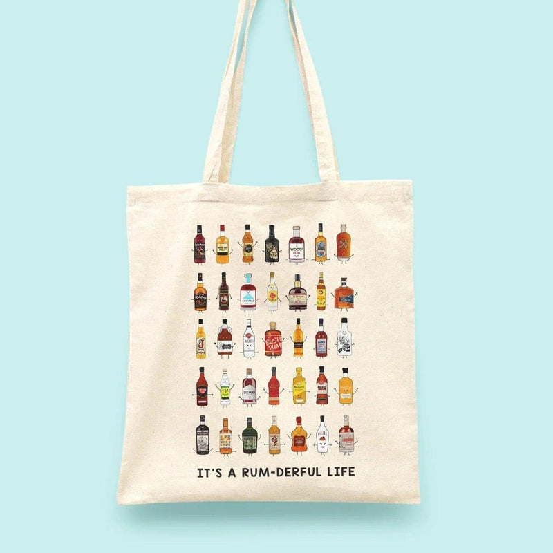A tote bag illustrated with bottles of rum and the words 'It's a rum-derful life'